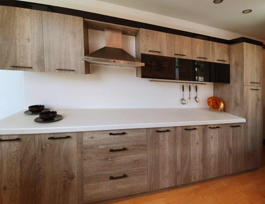 Wood kitchen with white countertop